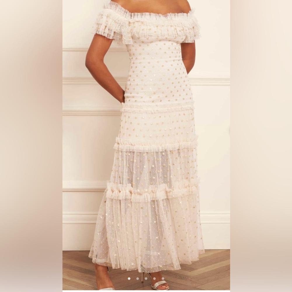 Needle and thread dress very very elegant worn only once and dried clean